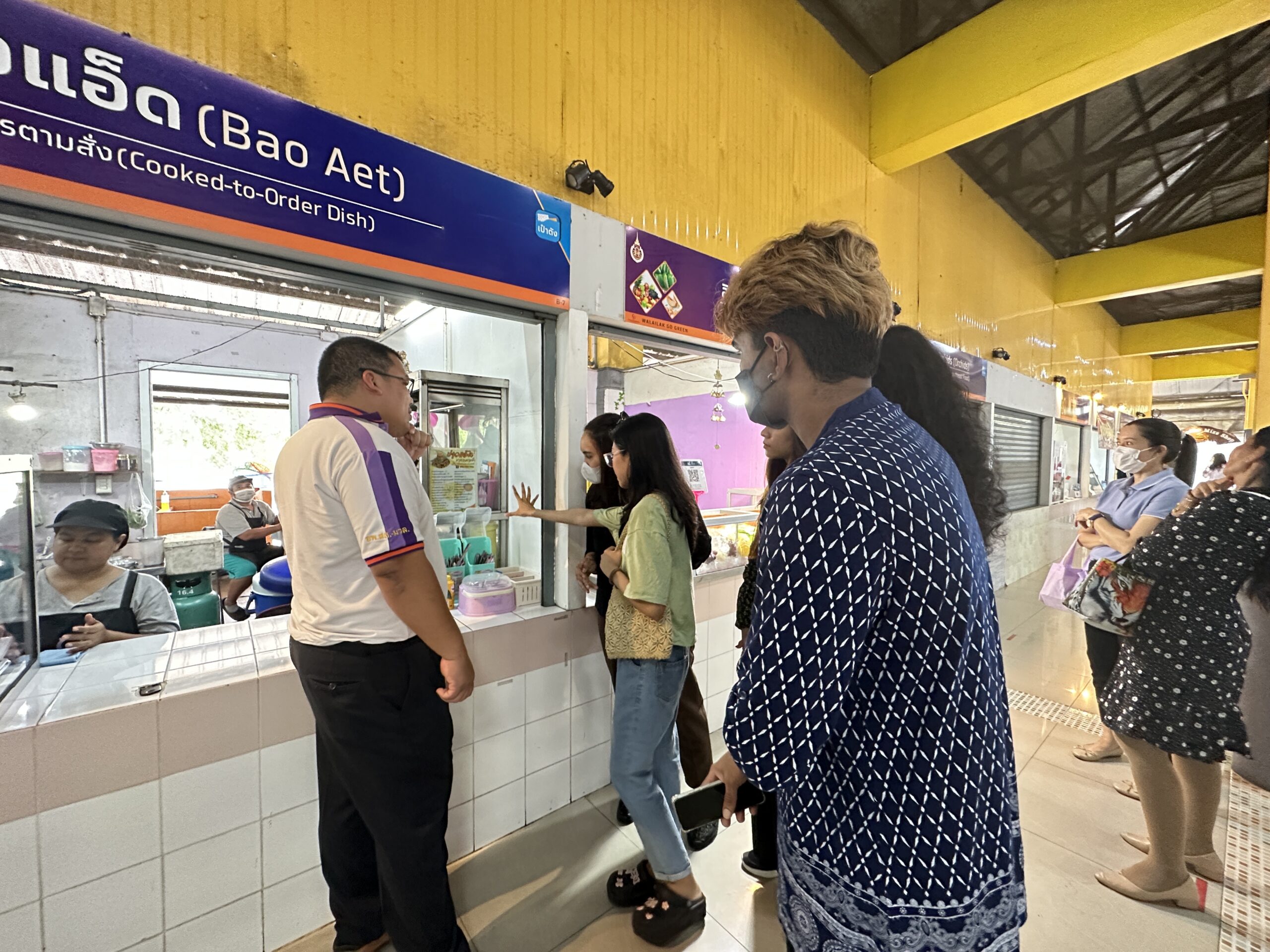 WUIC Students volunteered to translate the names of shops and menus at the Chor Pradu Canteen into English