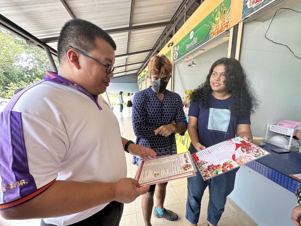 WUIC Students volunteered to translate the names of shops and menus at the Chor Pradu Canteen into English