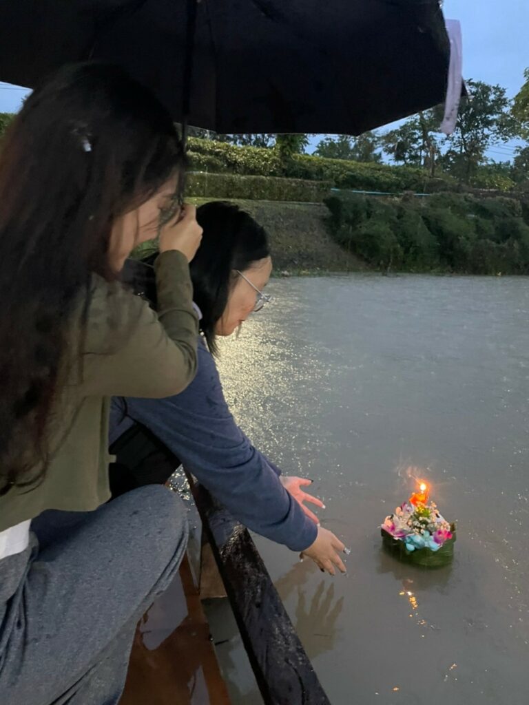 In a festive gathering, students from Walailak University's International College (WUIC), along with the Vice Dean and supporting staff, participated in the Walailak Loy Kratong celebration. The event, held in front of Thaiburi building at Walailak University, offered a rich cultural experience as attendees delved into Thai traditions, relished the vibrant festival atmosphere, and savored delectable Thai street food.